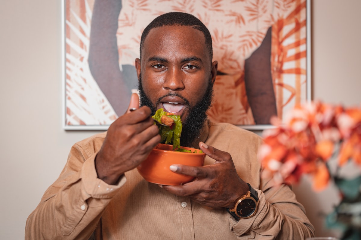 Calm person enjoying nutritious meal with vegetables and water